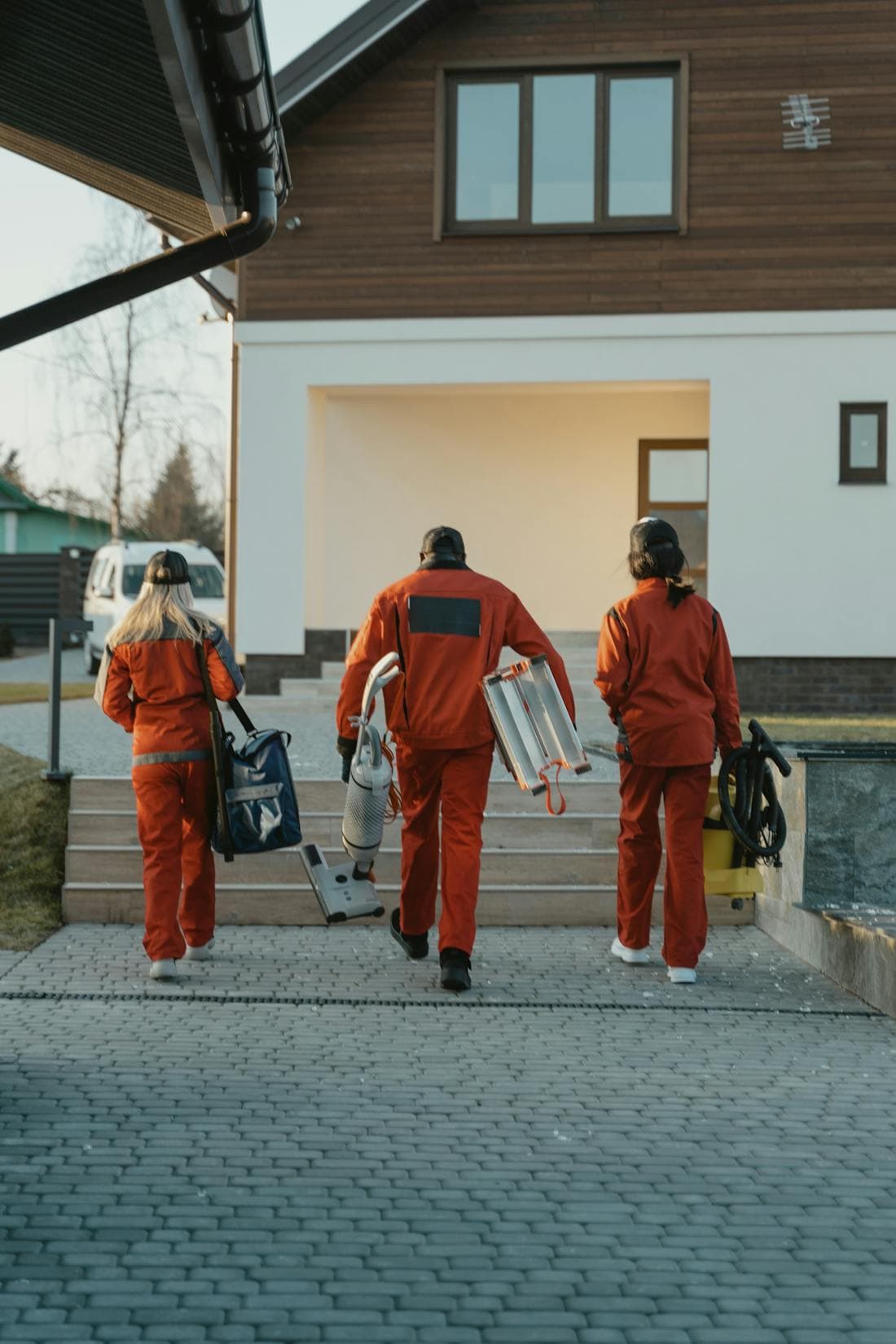 A cleaning crew arriving at a home